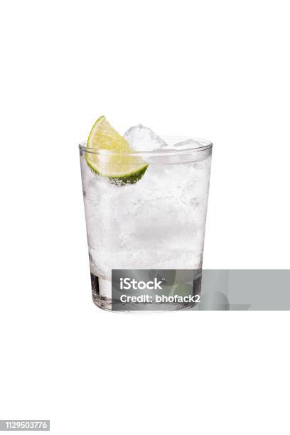 Refreshing Gin And Tonic On White Stock Photo - Download Image Now - Drinking Glass, Gin Tonic, White Background