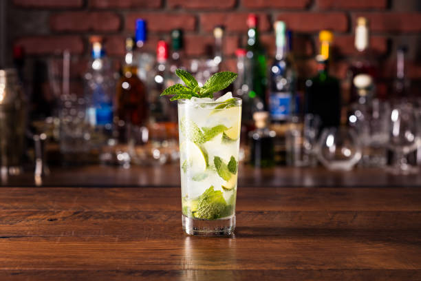 Refreshing Rum Mint Mojito Cocktail Refreshing Rum Mint Mojito Cocktail on a Table mojito stock pictures, royalty-free photos & images