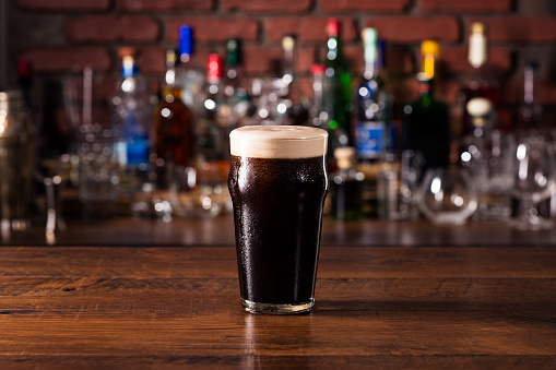 Refreshing Dark Stout Craft Beer on a Bar