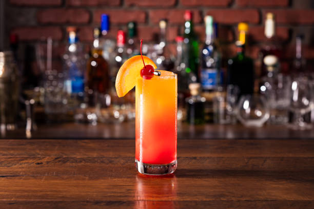 Refreshing Tequila Sunrise Cocktail Refreshing Tequila Sunrise Cocktail on a Bar tequila sunrise stock pictures, royalty-free photos & images