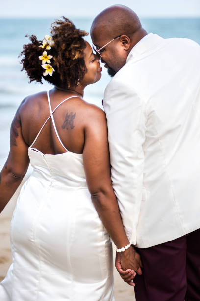 istock African American couple getting married at the beach 1129515753