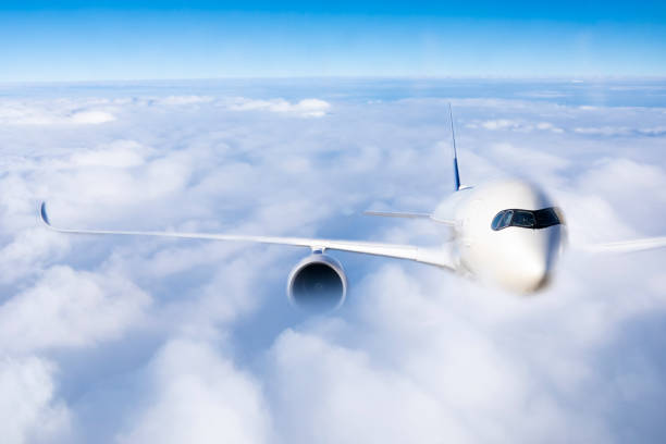 istock transportation business concept : air plane flying over the clouds 1129515915