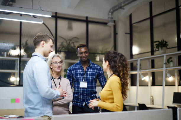 istock Multi-ethnic business team discussing presentation 1129517386