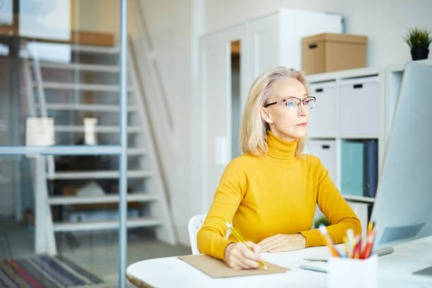 istock Mature Businesswoman at Work 1129522871