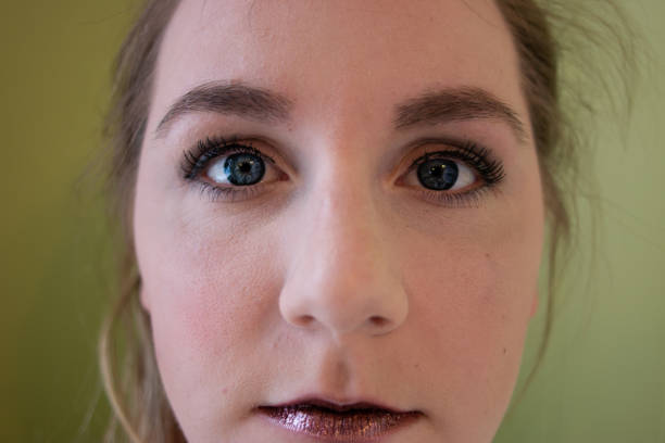 istock women portrait after applying makeup. nice lips and blue eyes 1129524066