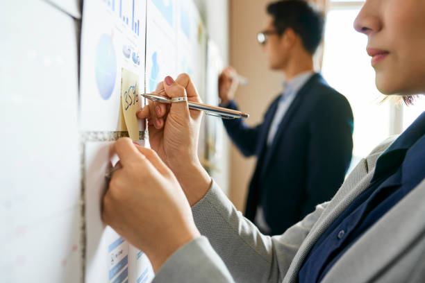 istock Businesswoman counting percentage 1129527823