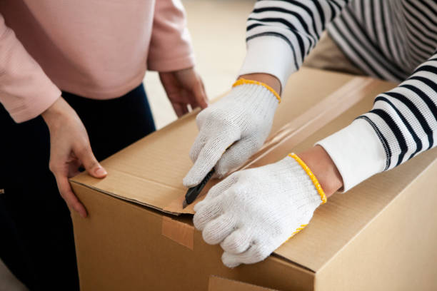 istock Open the cardboard box. Close up at hand. 1129527864
