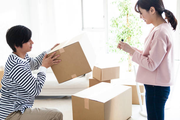 istock A couple preparing for moving in a bright room. 1129528738