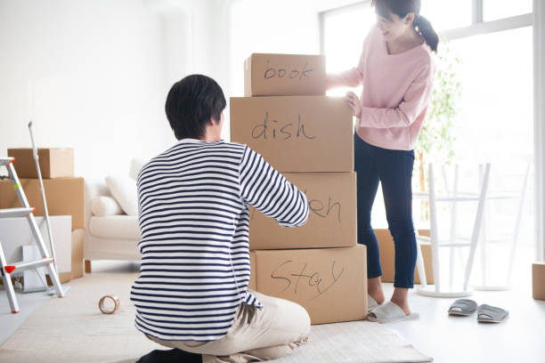 istock A couple preparing for moving in a bright room. 1129528765