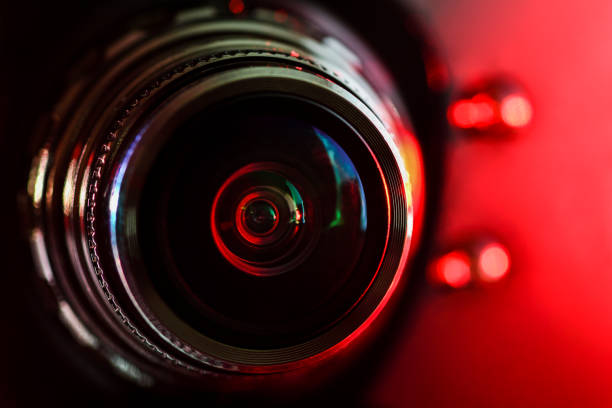 istock Camera lens and red backlight . Horizontal photography 1129532353