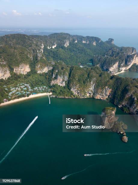 Aerial Image Of Ao Nang Beach In Krabi Province Thailand Beautiful Green Limestone Rocks White Boats Sailing On The Sea Stock Photo - Download Image Now