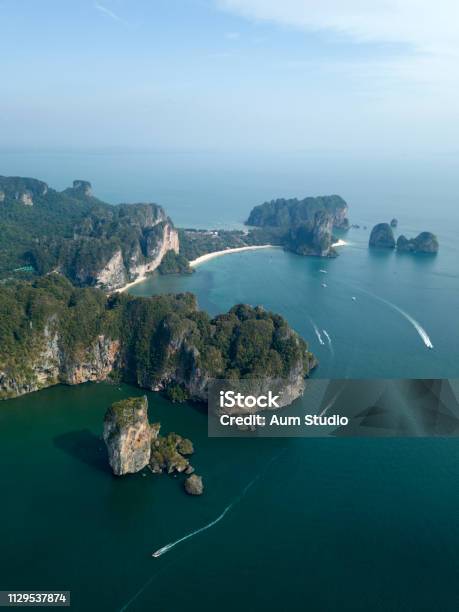 Aerial Image Of Ao Nang Beach In Krabi Province Thailand Beautiful Green Limestone Rocks White Boats Sailing On The Sea Stock Photo - Download Image Now