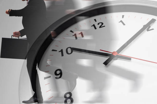 istock fast speed business working time with businessman running hurry up. 1129545399