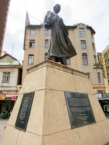 Johannesburg, South Africa - January 17, 2012: Mahatma Gandhi Statue in Gandhi Square, Johannesburg, is a bronze sculpture of the Indian independence campaigner and pacifist Mahatma Gandhi.