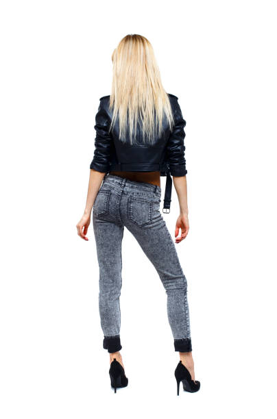 istock Back view of a woman standing. 1129550469