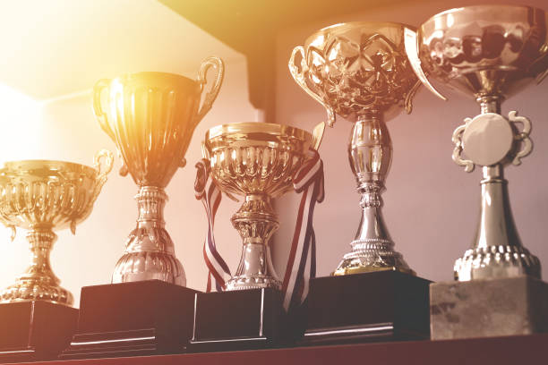 group of trophies on shelf - silver medal medal silver competition imagens e fotografias de stock