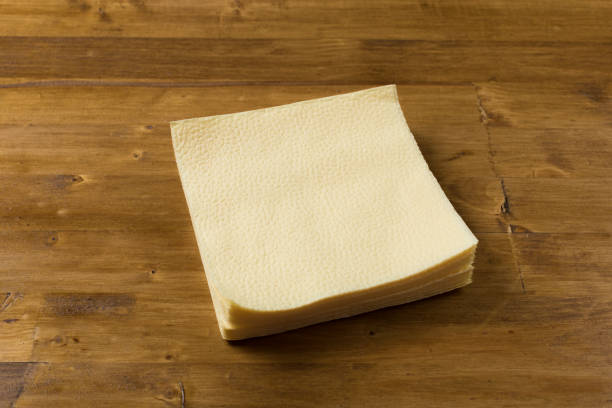istock yellow paper napkin on wooden background 1129556355