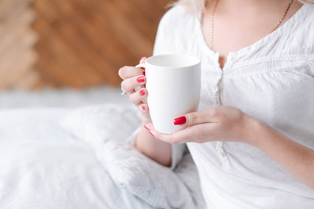 istock wake beverage woman bed hold morning drink 1129558797