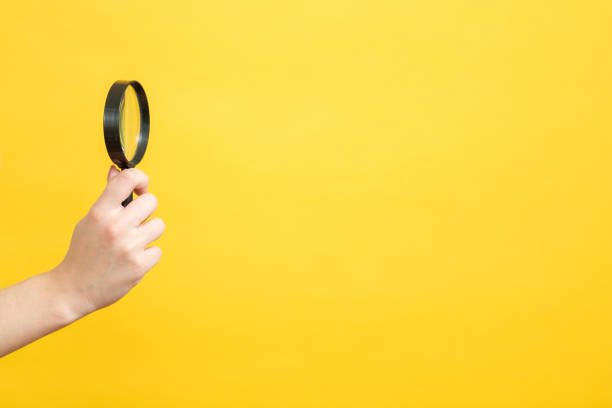 istock conceptual search magnifier female hand copyspace 1129558868