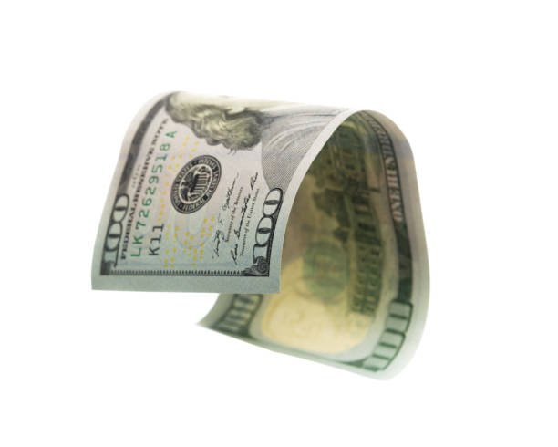 istock flying banknote of hundred dollars isolated on white 1129559949
