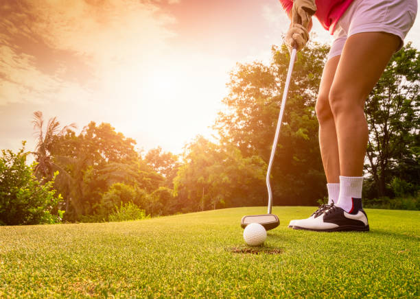 istock Golfer focus putting golf ball. 1129560194