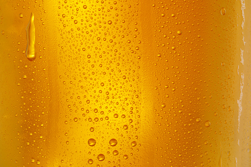 Background Cool beers with beer bubbles on top a glass at the party