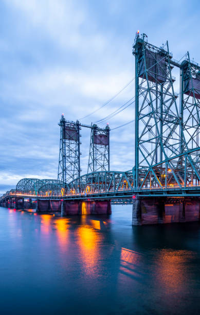 istock Lifting sectional Columbia Interstate bridge over the Columbia River with colorful evening lights in Portland area 1129565526
