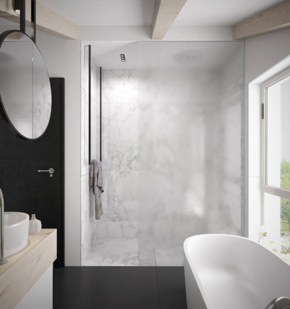 istock Spacious and bright modern bathroom interior with a shower cabin with glass wall 1129565806