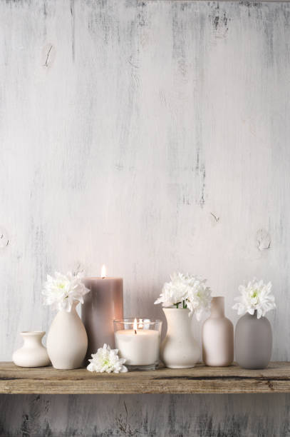 istock White flowers in neutral colored vases and candles 1129566707
