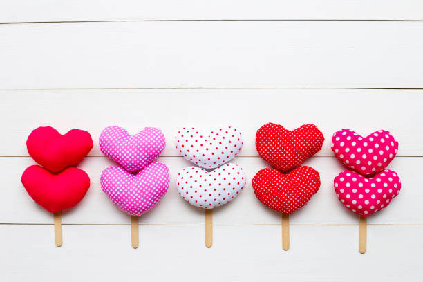 istock Valentine's hearts on white wooden background. 1129566747