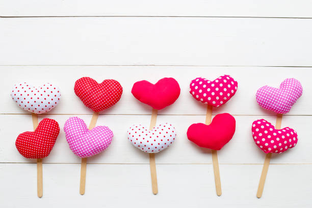 istock Valentine's hearts on white wooden background. 1129566968