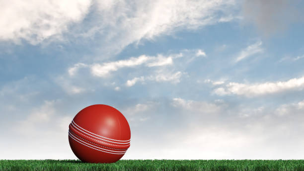 istock Cricket ball put on a well cut lawn 1129568311