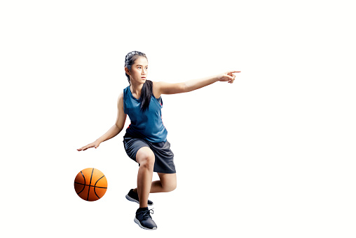 istock Portrait of asian girl in blue uniform playing basketball 1129569628