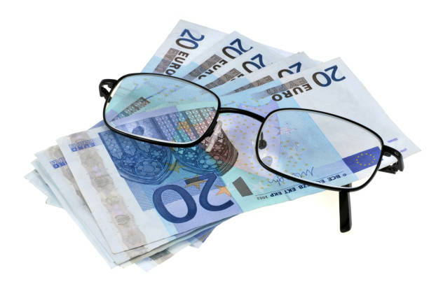 Ophthalmology expenditures glasses placed on euro banknotes on a white background dépense stock pictures, royalty-free photos & images