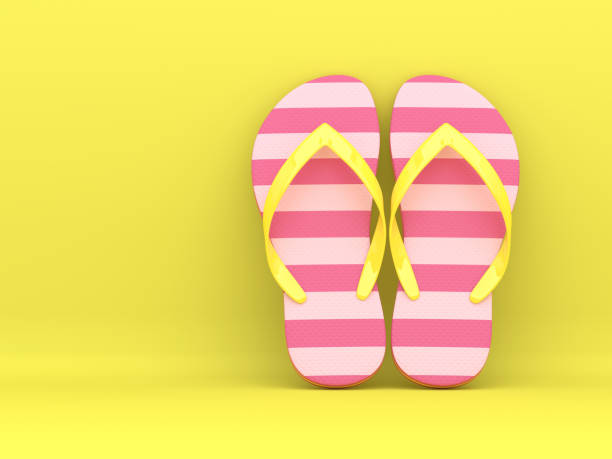 istock 3d render of flip flops over yellow 1129571513
