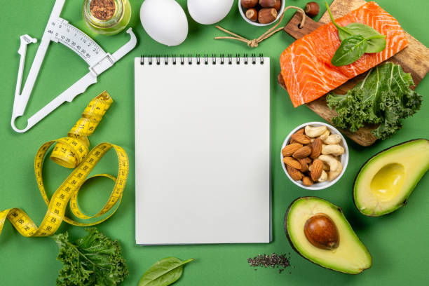 istock Keto diet concept - salmon, avocado, eggs, nuts and seeds 1129572601