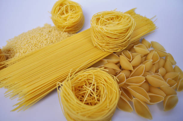 istock food - pasta set with glasses 1129573560