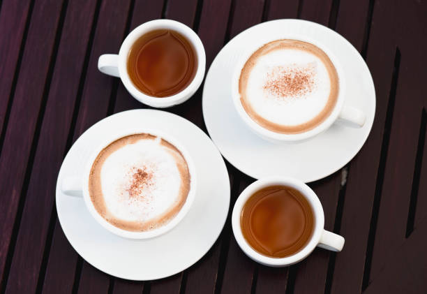 istock hot coffee and tea on wood table 1129574034