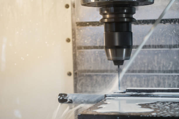 istock CNC machining center working in factory 1129574199