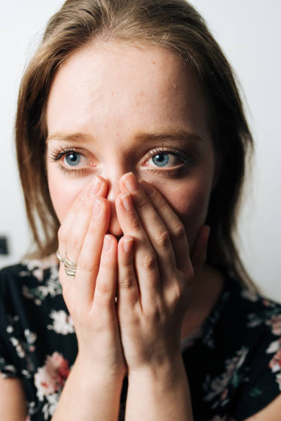 istock Alone and anxious young woman at home 1129574968
