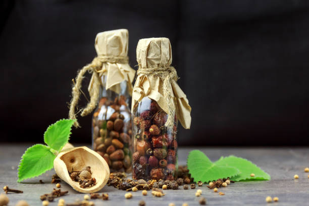 Dried hawthorn fruits on black background. Front view with copy spase