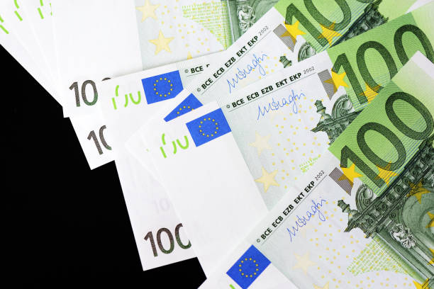 istock One Hundred euro banknotes on a dark background close up 1129575423