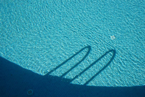 shadow of a Swimming pool water ladder