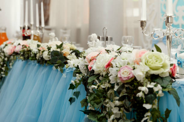 istock Flower wedding decoration with candles and angel 1129578543