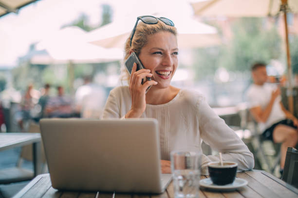 istock Lady talking on phone in cafe 1129579260