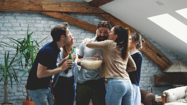 istock Girl feeding her friend with popcorn 1129579278