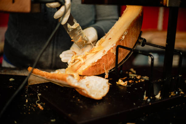 колесо сыра раклетт - raclette cheese стоковые фото и изображения
