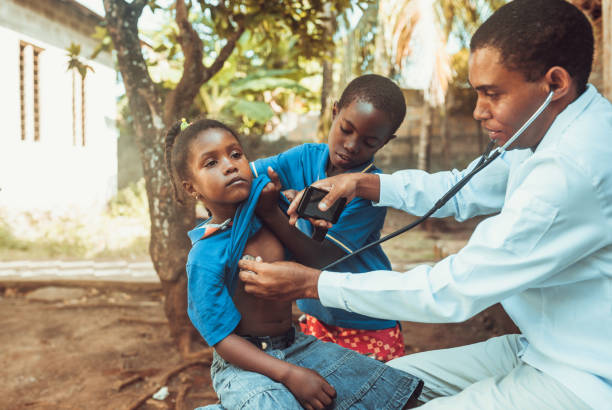 istock Doctor meet African child 1129580794