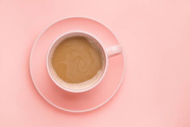 istock Coffee cup on pink background. Minimal concept 1129582452