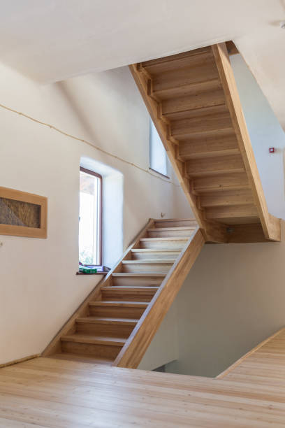 istock Wooden staircase without laminated timber railing 1129584626